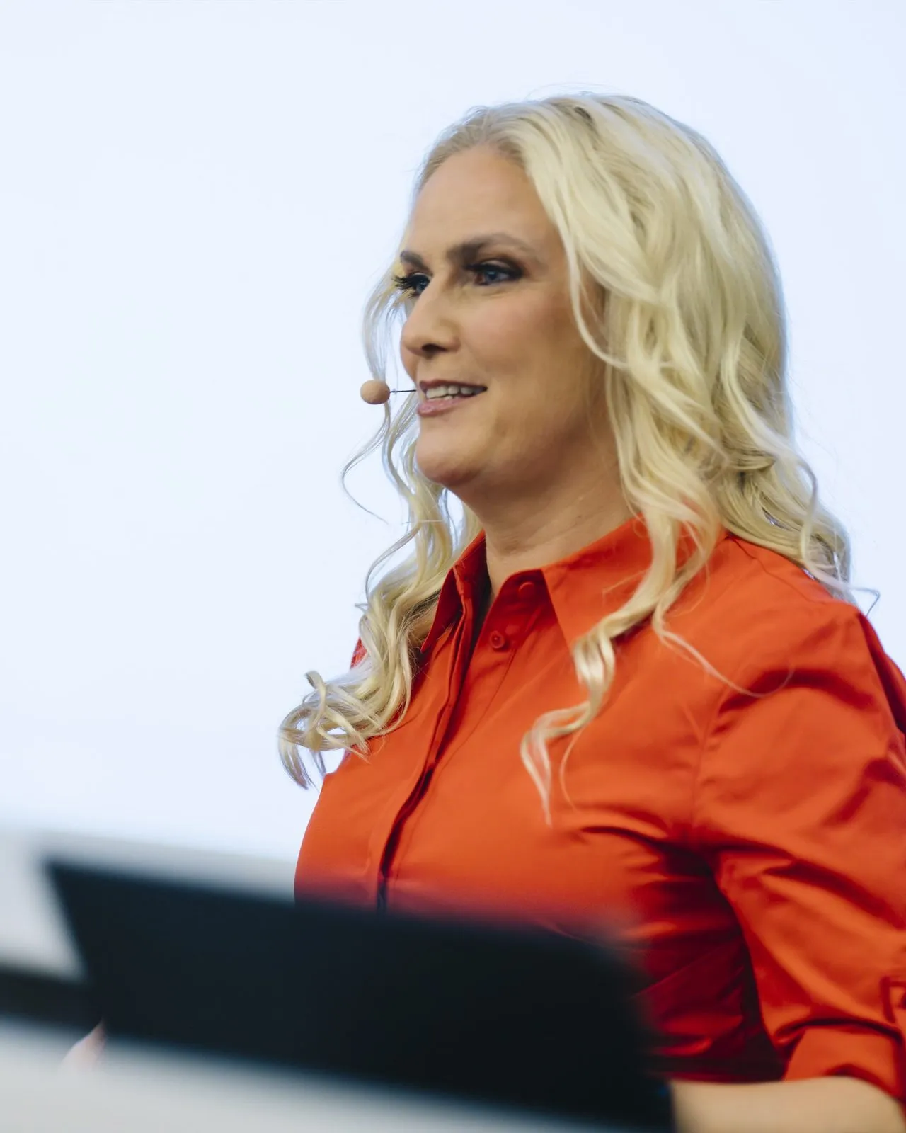 Sigrun speaking at the lectern at SIGRUN Live 2025