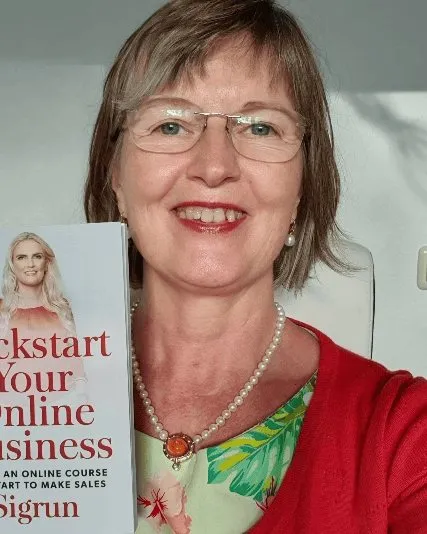 A reader holding Kickstart Your Online Business