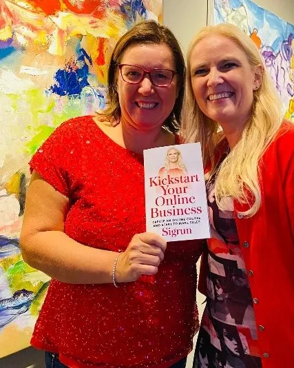 A reader holding Kickstart Your Online Business